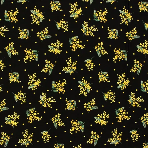 Flores amarillas de mimosa estampadas en tela de color negro