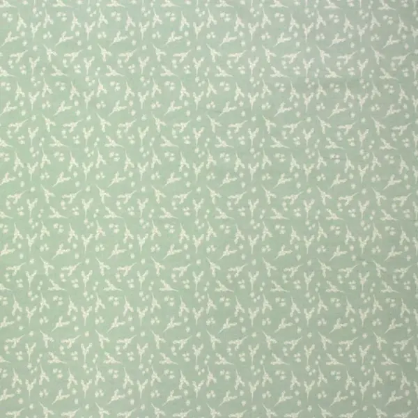 Ramilletes blancos sobre fondo verde pastel