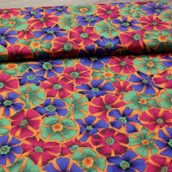 Tela de algodón Kaffe Fassett Pinwheels Autum diseño geométrico rojo y naranja de 110cm - Vista del lomo enrollado