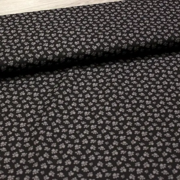 Huellas Gris, Tela de fondo negro estampada con huellas en color gris — vista 3