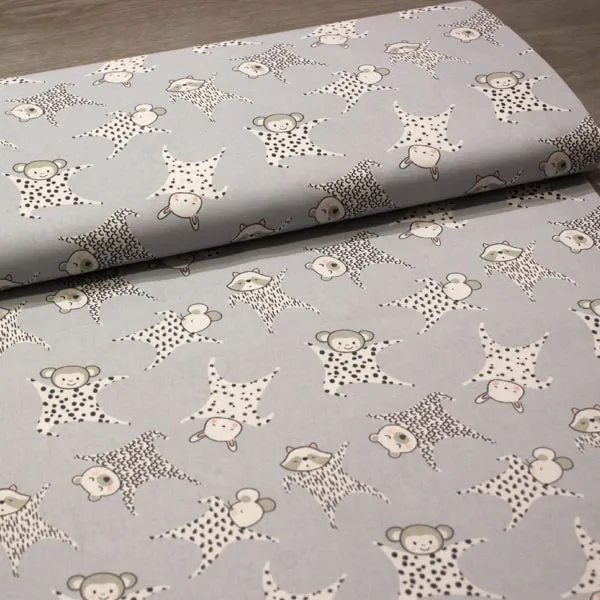 Tela de algodón infantil Muñeco Doudou para bebés fondo gris claro con estrellas 150cm - Vista del lomo enrollado